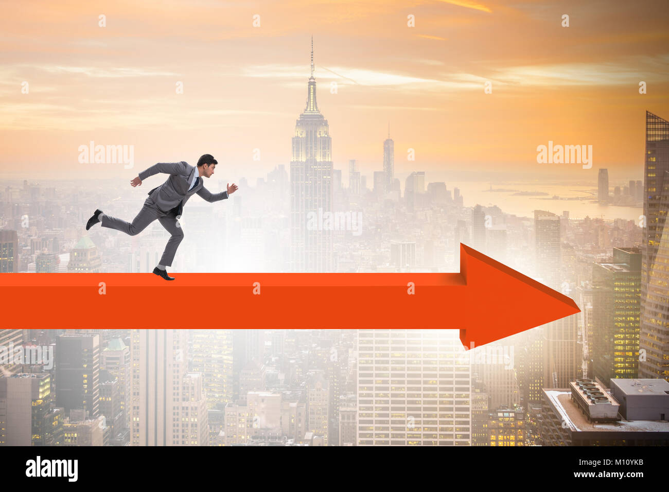 Businessman walking on arrow in business concept Stock Photo - Alamy