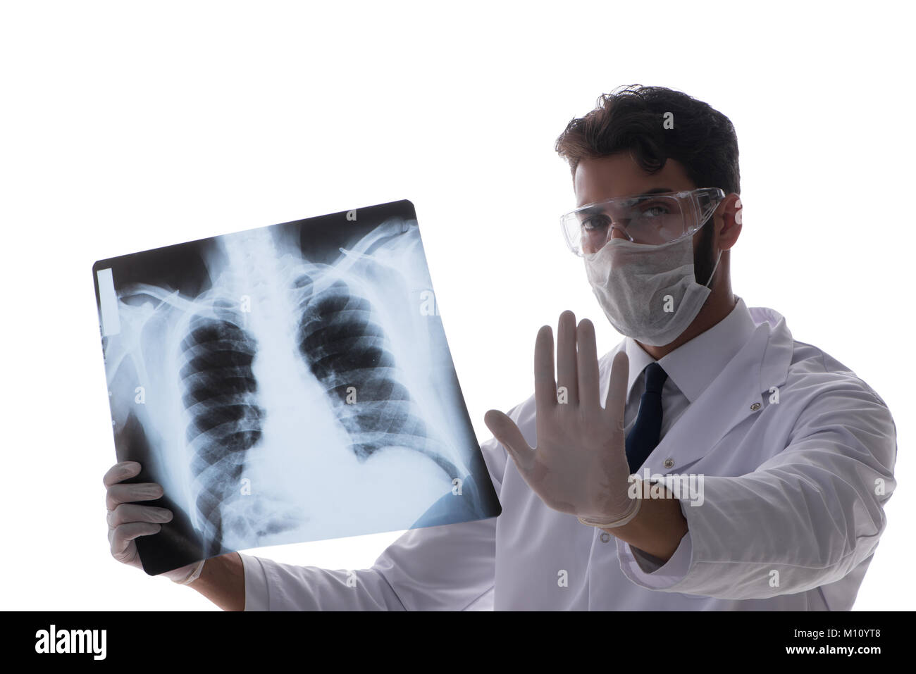 Young doctor looking at x-ray images isolated on white Stock Photo - Alamy
