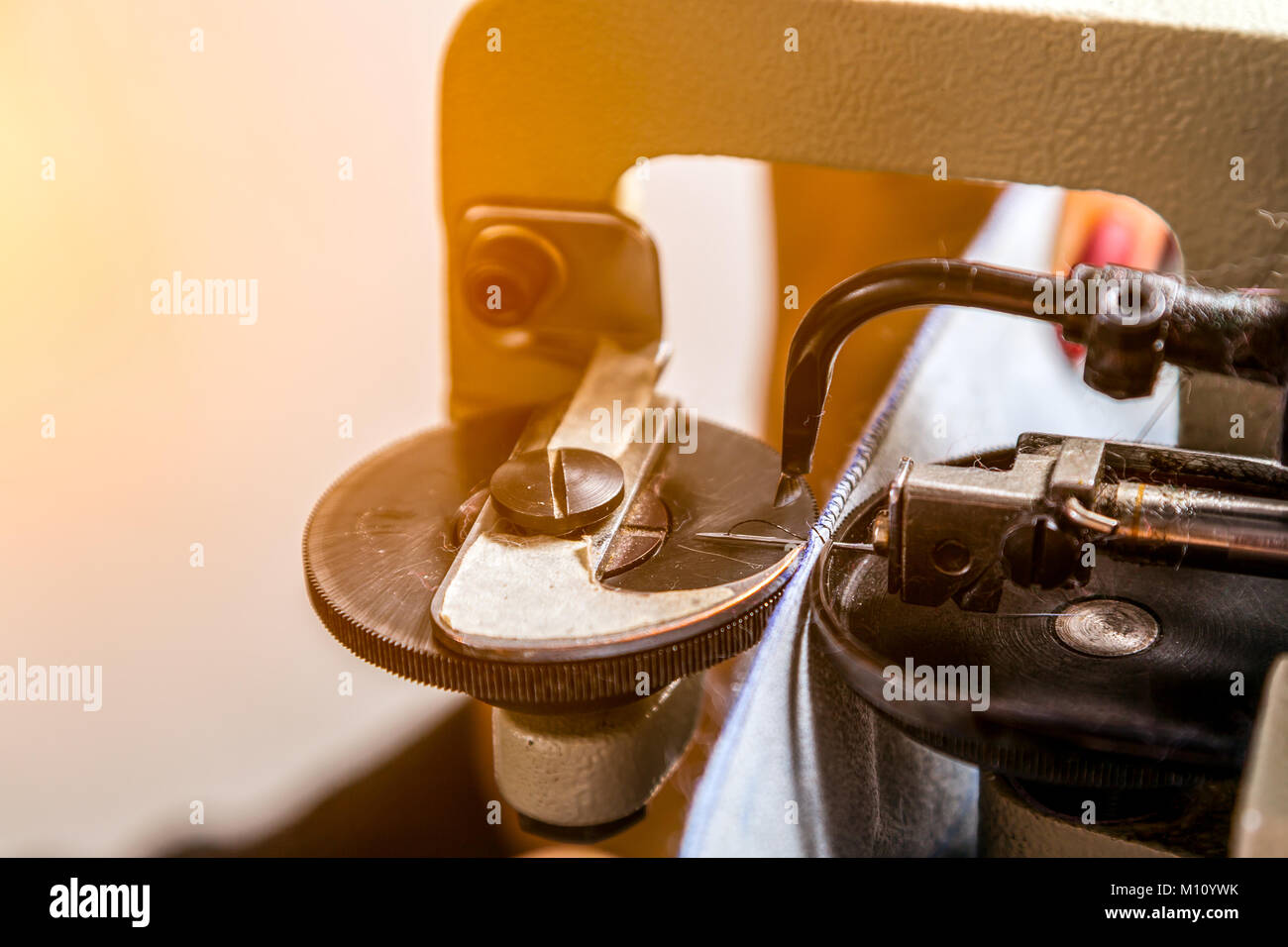 A close-up of a mettalic furrier sewing machine for fur and leather