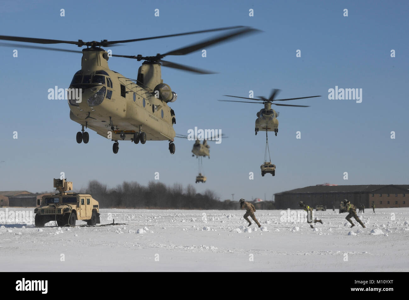 Soldiers with Company B, 6th General Support Aviation Battalion, 101st Combat Aviation Brigade, 101st Airborne Division (Air Assault) and the 3rd Brigade Combat Team participate in a large-scale air assault training exercise January 19, 2018 at Fort Campbell, Kentucky. The training event demonstrated the troop’s readiness to deploy and ability to integrate land operations with air support. (U.S. Army photo by Sgt. 1st Class Andrew McClure, 101st Combat Aviation Brigade) Stock Photo