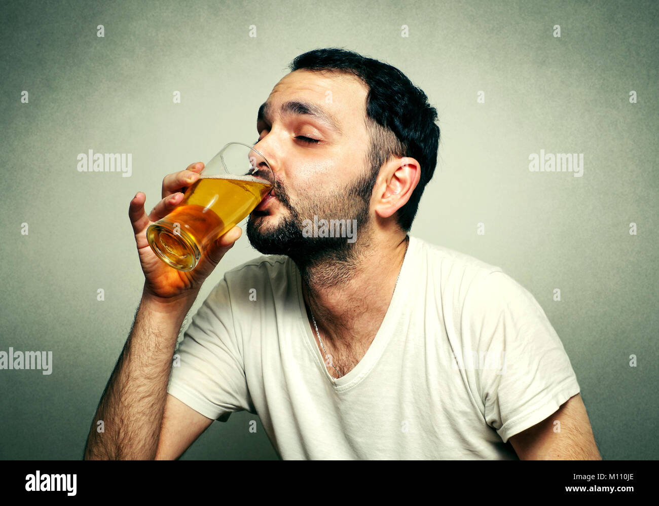 Funny sport fan drinking beer Stock Photo Alamy