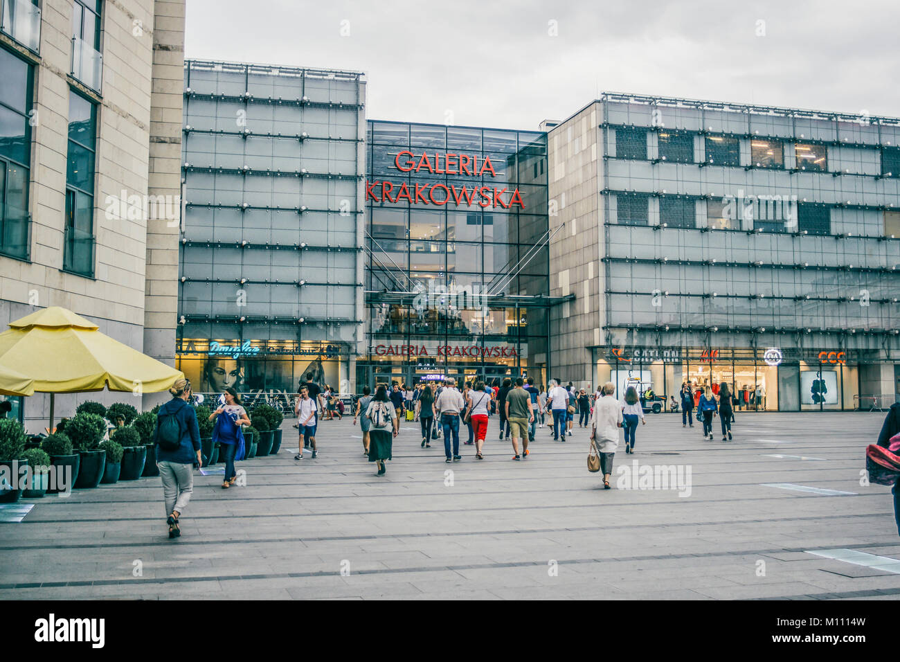 People walking on the square next to the Galeria Krakowska shopping center in Krakow, Poland Stock Photo
