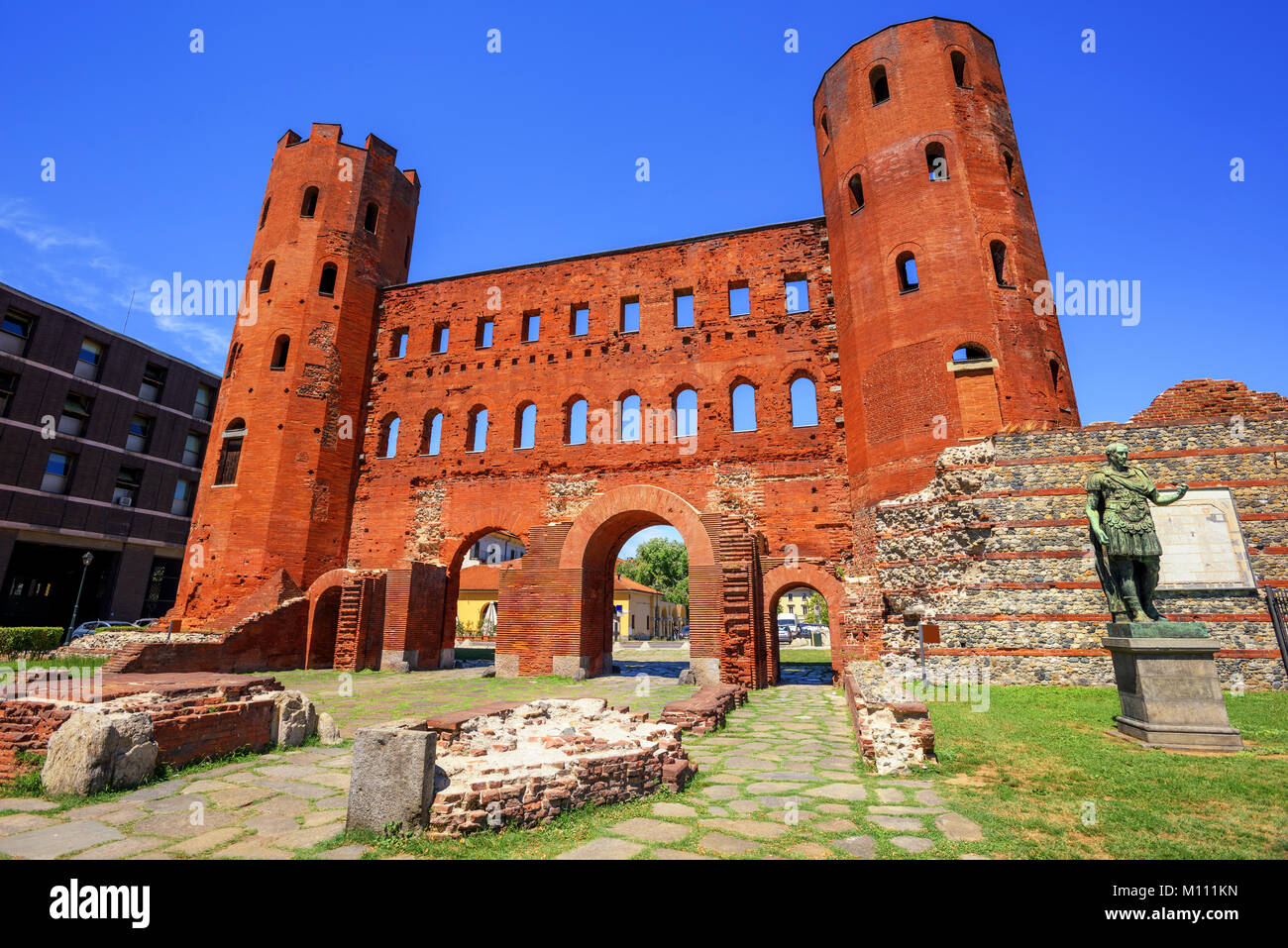 The Palatine Towers, a red brick ancient roman city gate in the Old ...