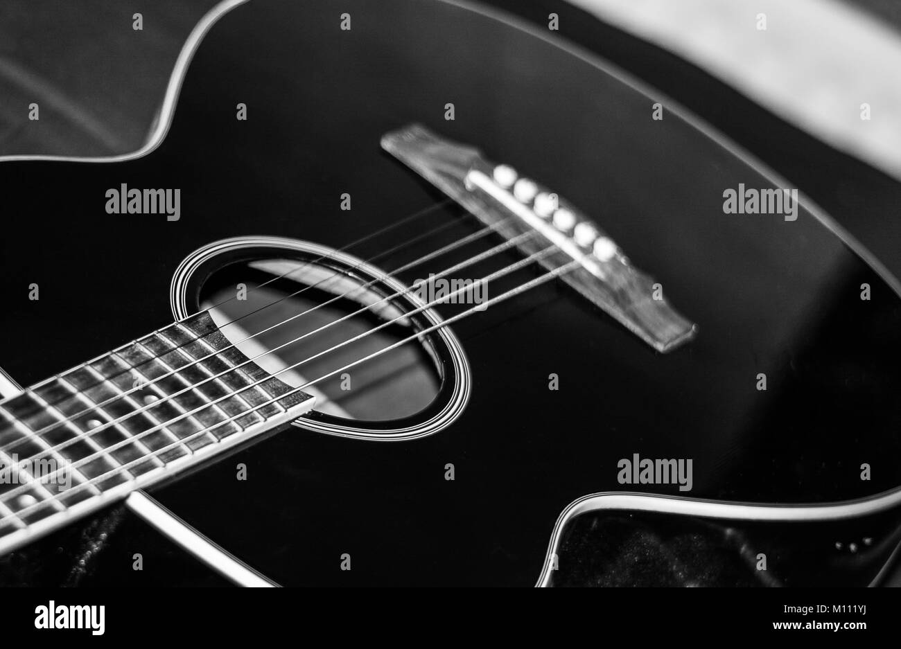 Acoustic Guitar just waiting to be played! Stock Photo