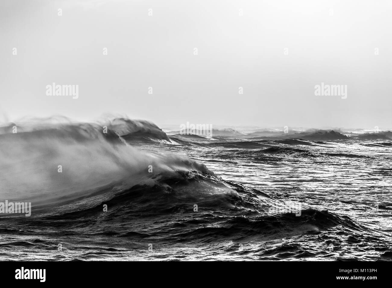 Big waves during a storm at dawn - Luanco, Asturias Stock Photo