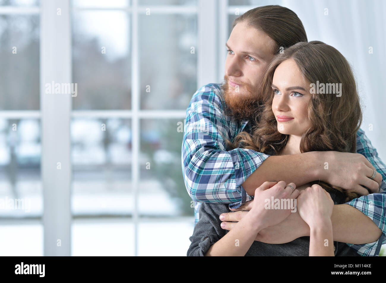 beautiful young couple hugging Stock Photo - Alamy