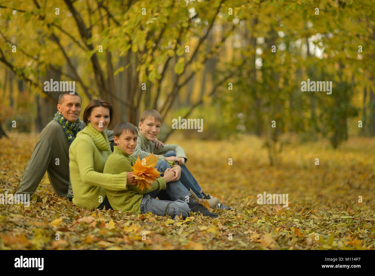 family in autumn forest Stock Photo - Alamy