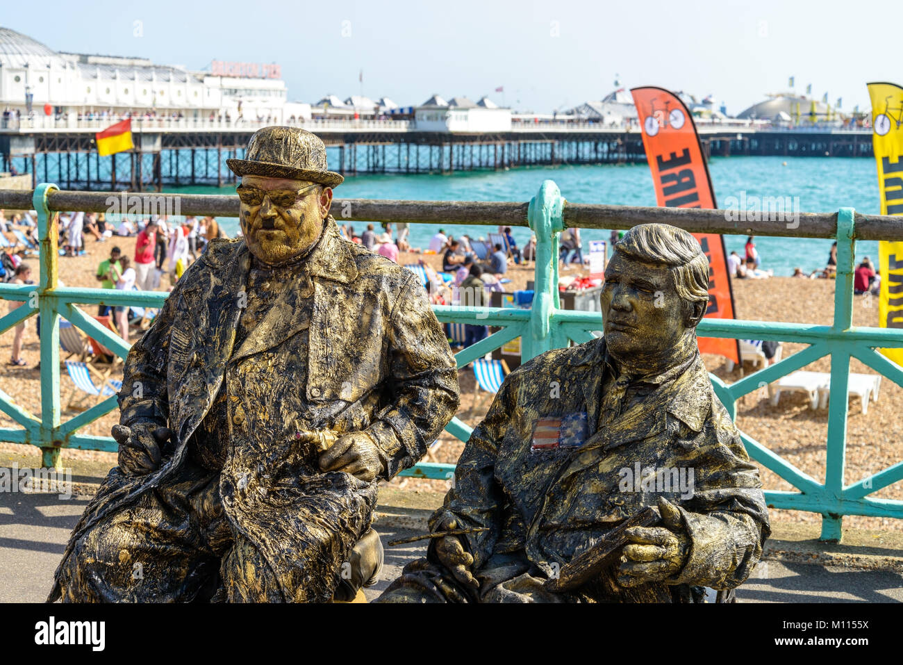 Look alike Hardy & Laurel seat at Brighton beach Stock Photo