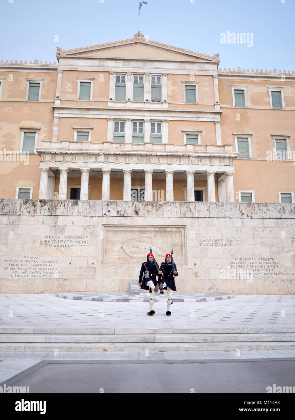 ATHENS,GREECE - MARCH 26, 2016: The Greek Presidential guards called Tsoliades dressed in traditional uniform at the monument of the unknown soldier i Stock Photo
