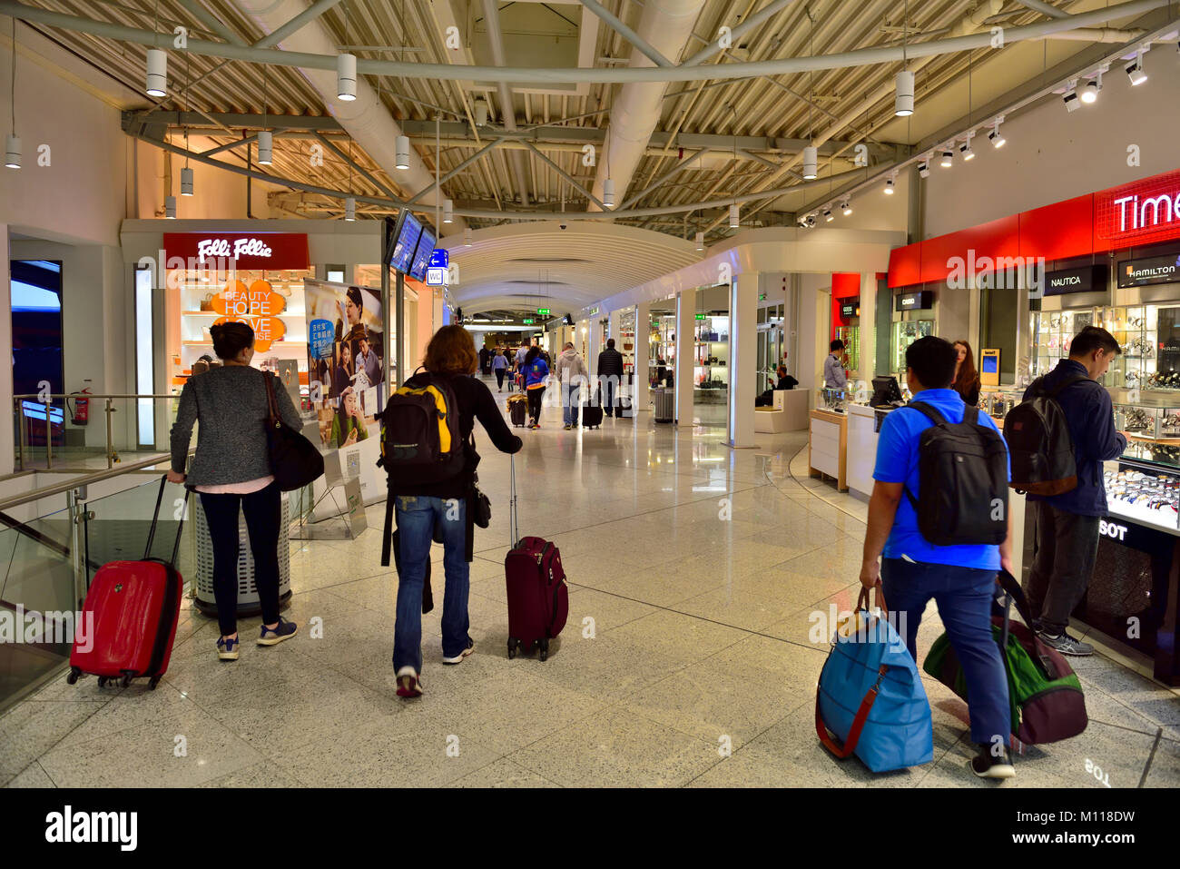Inside Athens international airport, Greece. Hallway to flight boarding gates with shops along the way Stock Photo