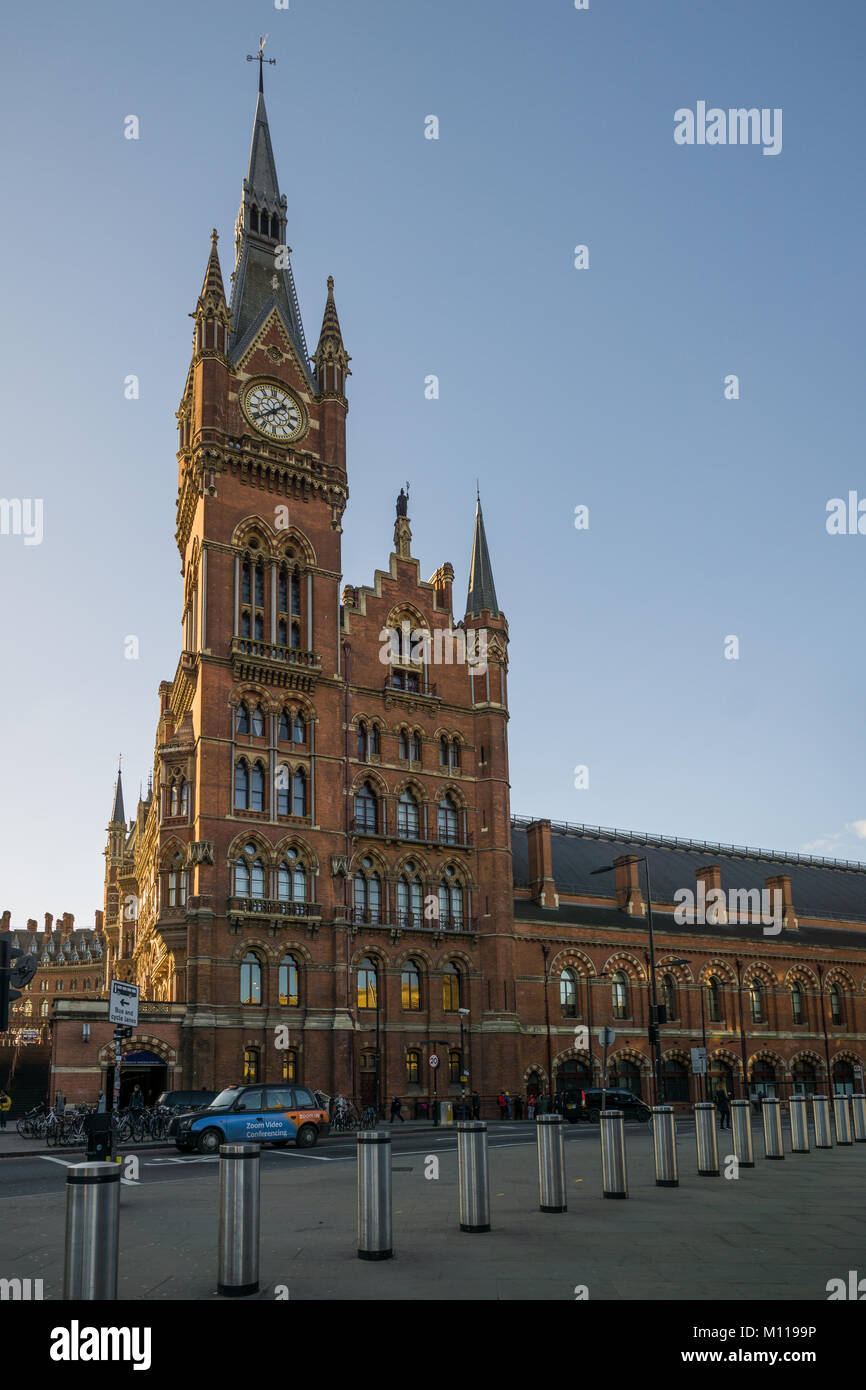 Panorama of ornate St. Pancras railway station hotel from the side while sunset. Stock Photo