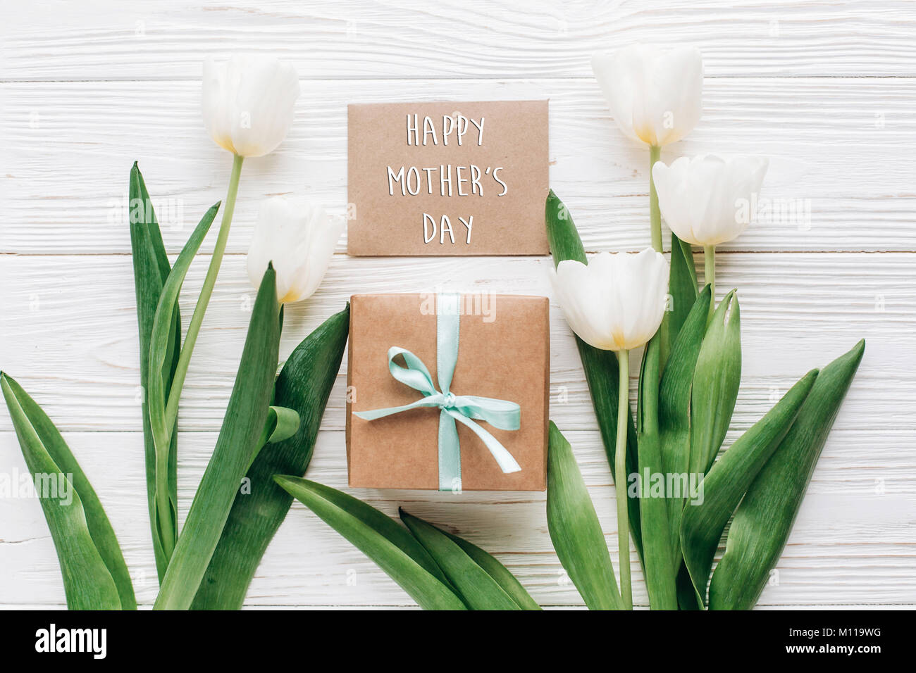 happy mothers day text sign on greeting card with stylish present box ...