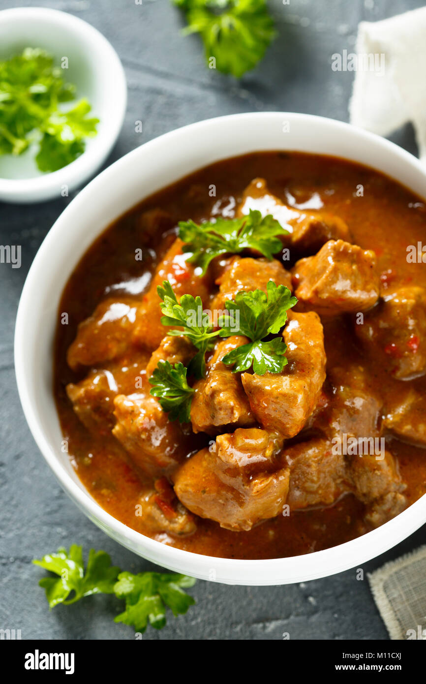 Beef goulash with tomatoes Stock Photo - Alamy