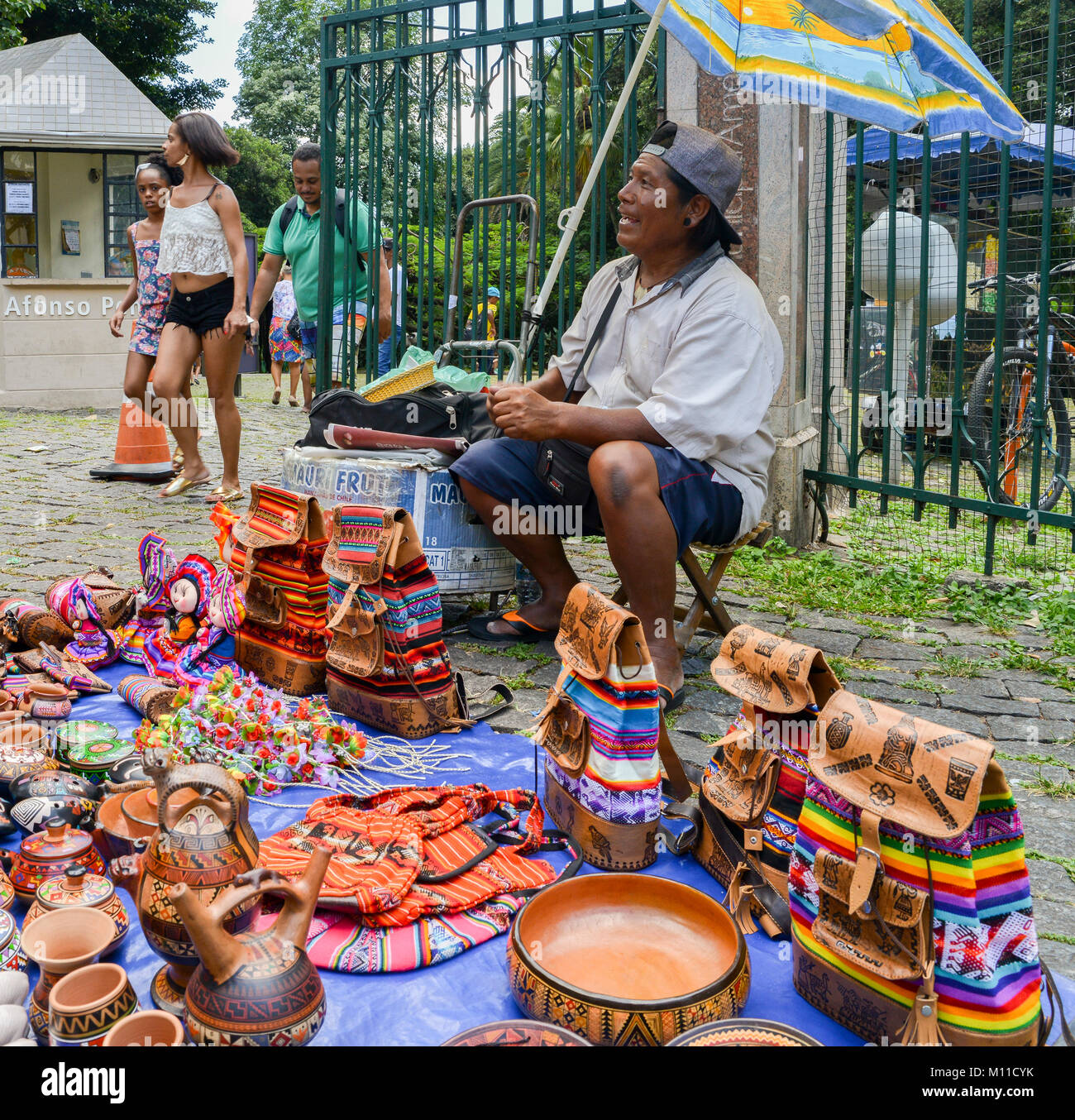 Indigenous Brazilian man selling arts and crafts at a street market, Belo Horizonte, Minas Gerais, Brazil Stock Photo