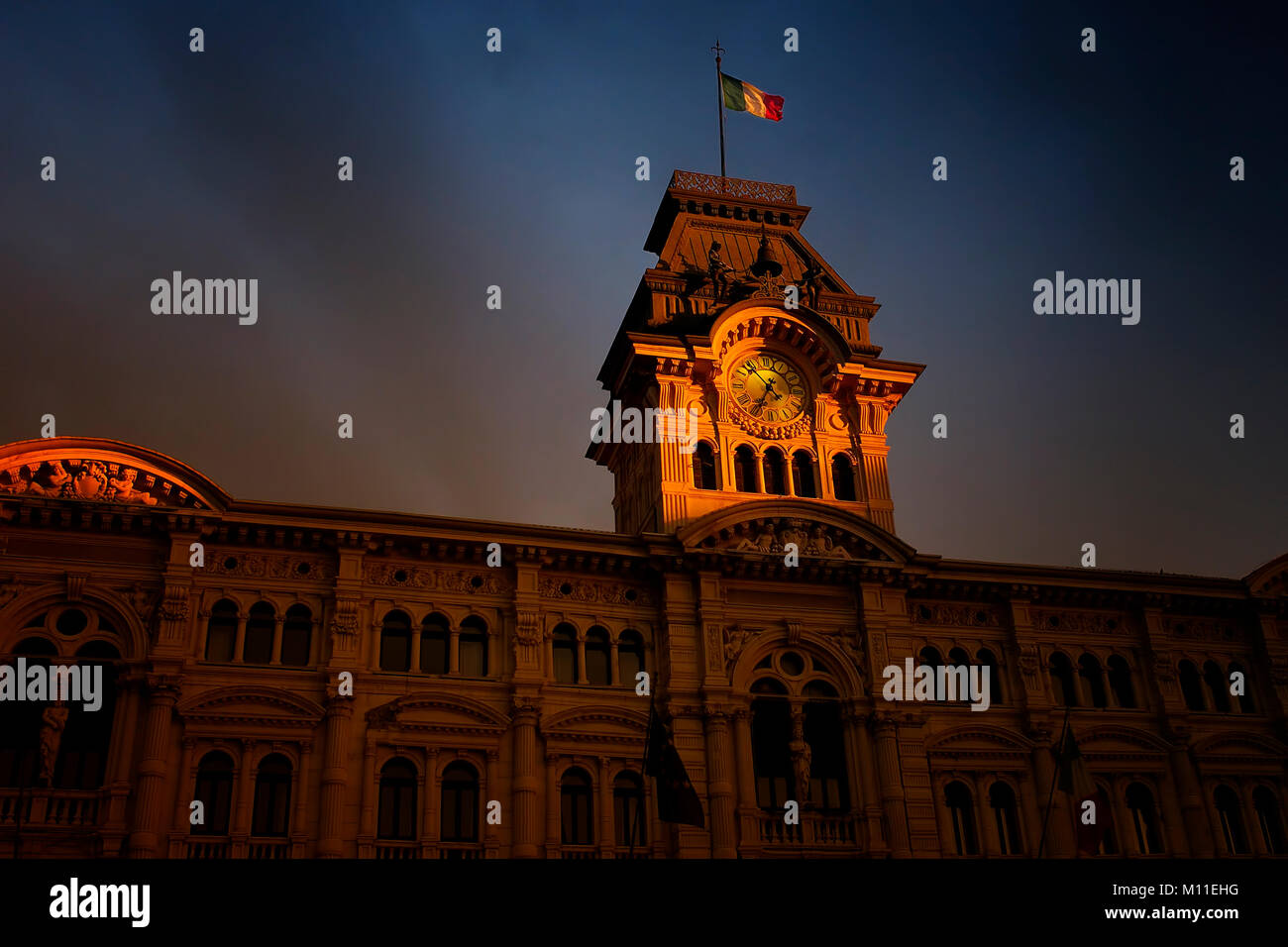 Trieste. Detail of the City Hall, in Piazza Unità d'Italia, in a stunning sunset light. Stock Photo