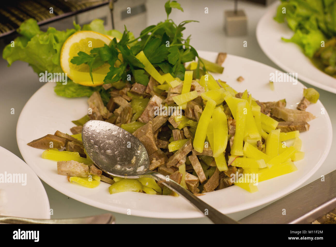 Salad from boiled tongue with the sweet green pepper Stock Photo Alamy