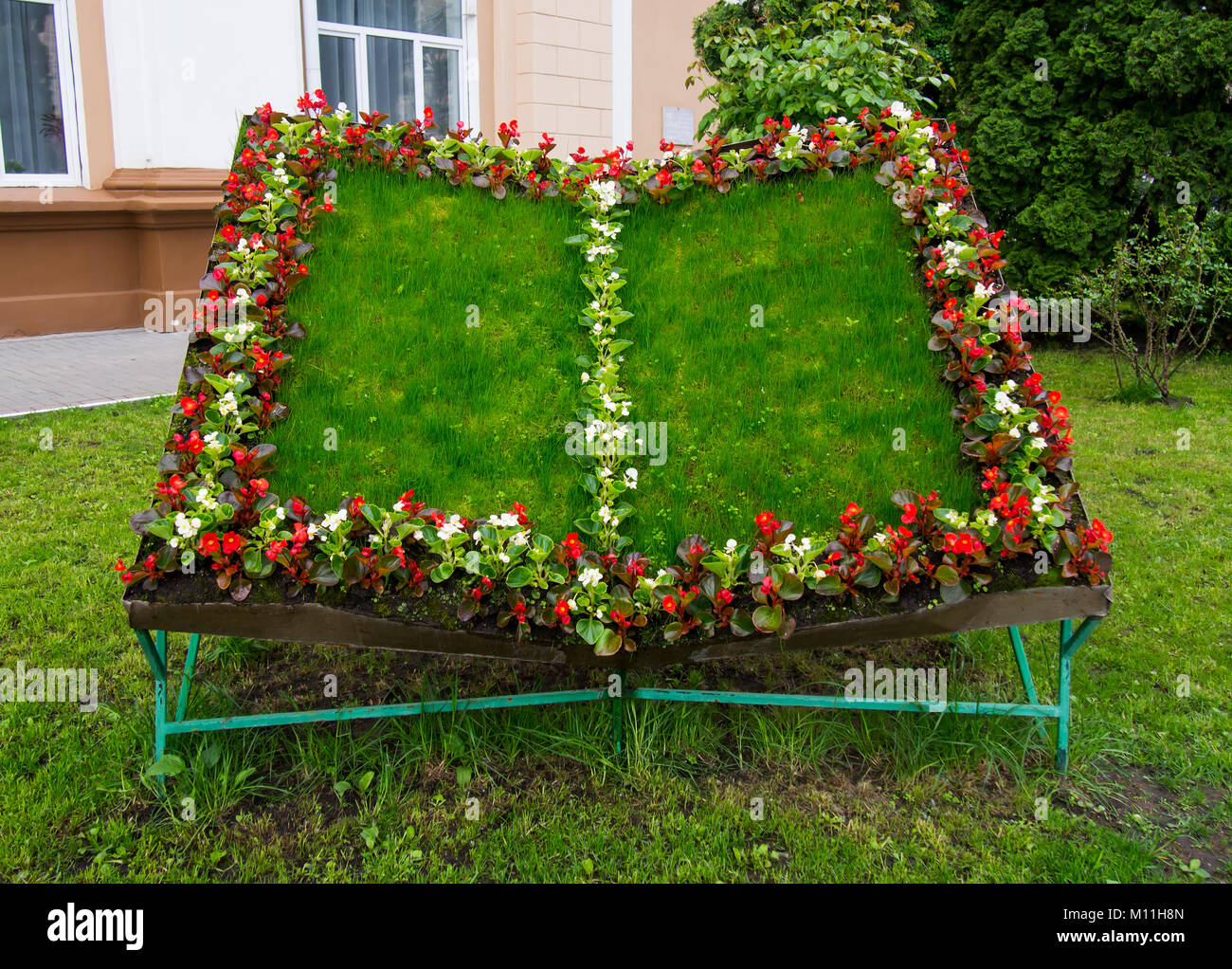 A flower bed in the form of an open book Stock Photo Alamy