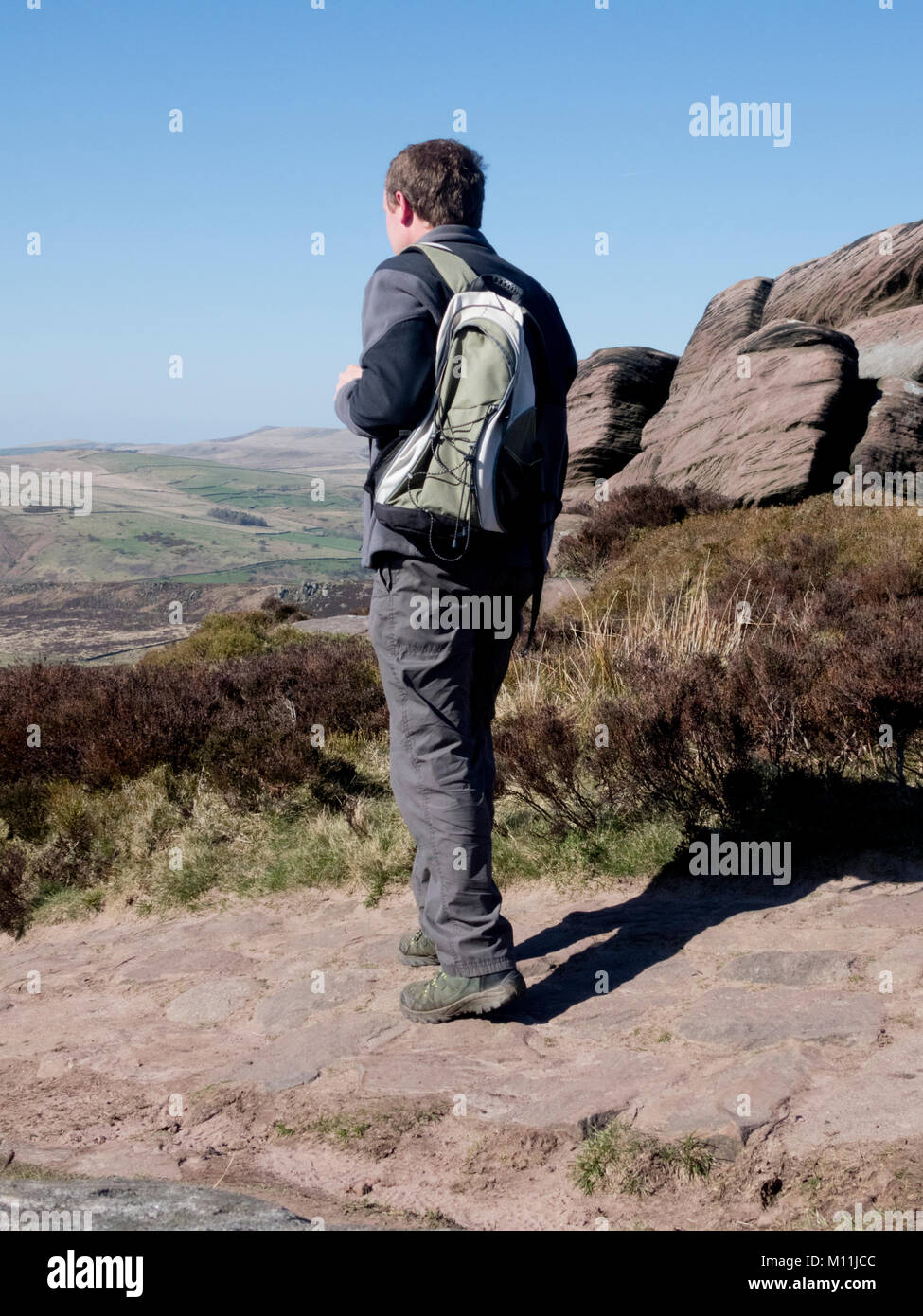 Caucasian Middle Aged Man Walking at The Roaches, Peak District National Park, Staffordshire, England, UK in April Stock Photo