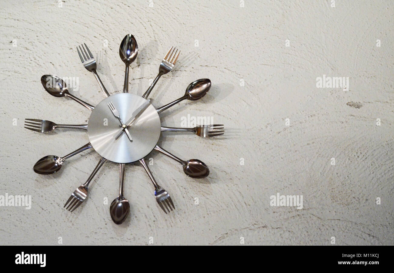 Clock with forks and spoons Stock Photo Alamy