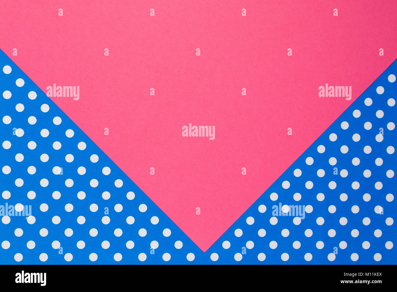Abstract geometric pink and blue polka dot paper background. Stock Photo