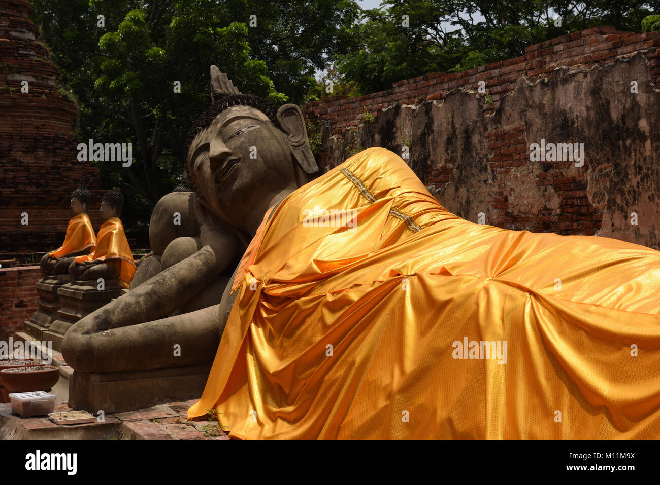 Statue of a reclining Buddha in the grounds of Wat Phutthaisawan, Ayutthaya, Thailand Stock Photo