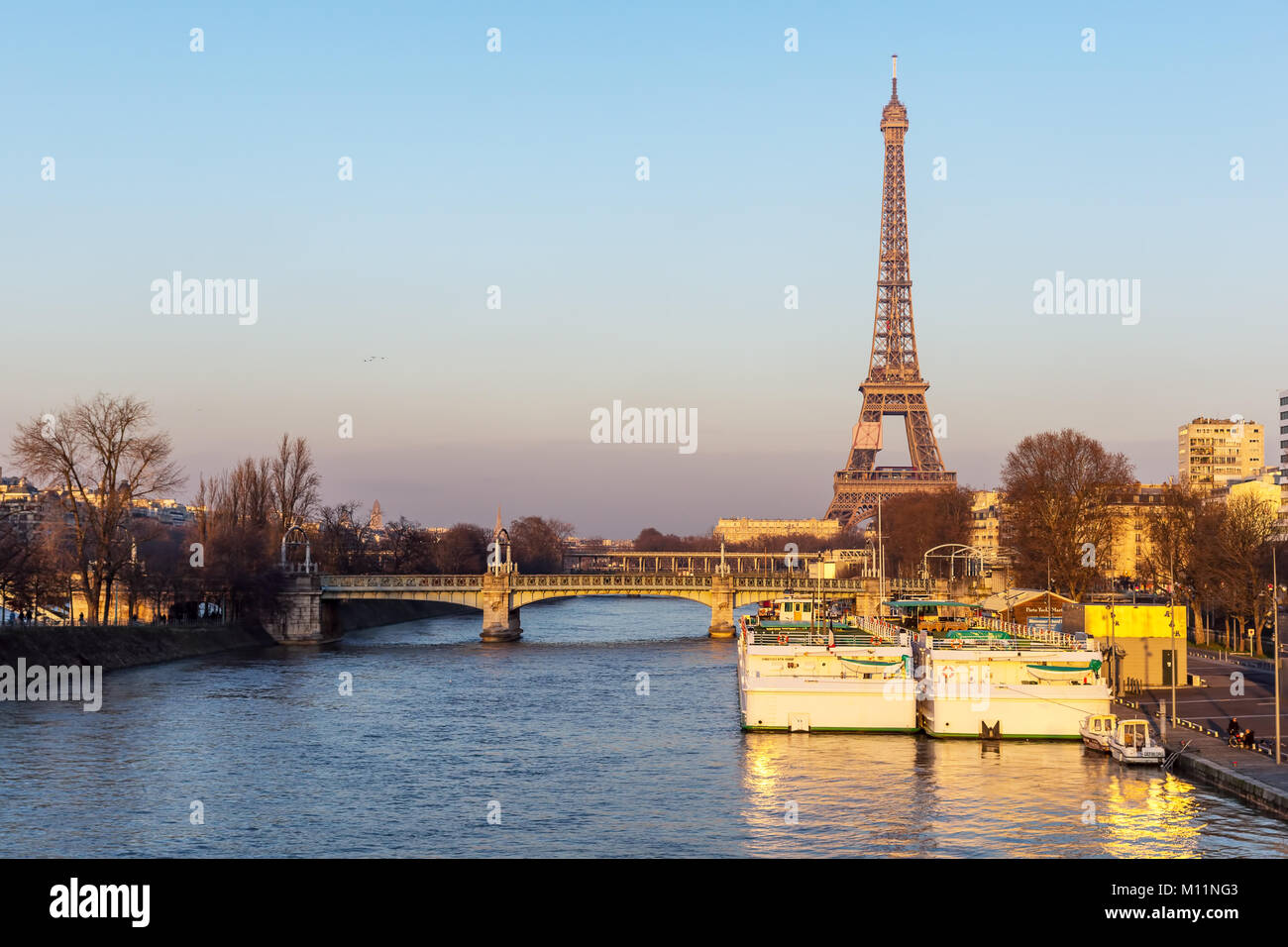 Sunset on Eiffel tower and Pont Rouelle - Paris, France Stock Photo