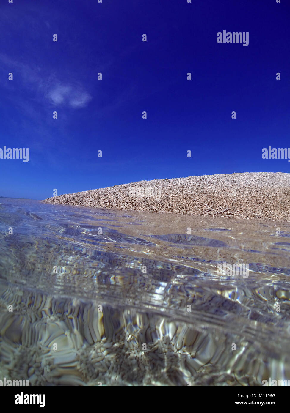 Coral rubble bank and clear water, Kent Island, Barnard Islands National Park, Great Barrier Reef, Queensland, Australia Stock Photo