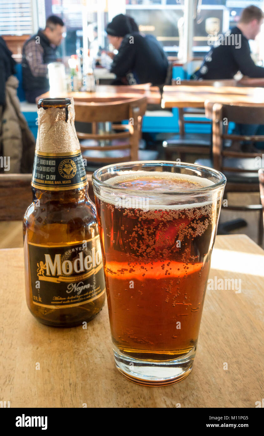 A bottle and glass of Negra Modelo Mexican beer in a restaurant in New York  City Stock Photo - Alamy