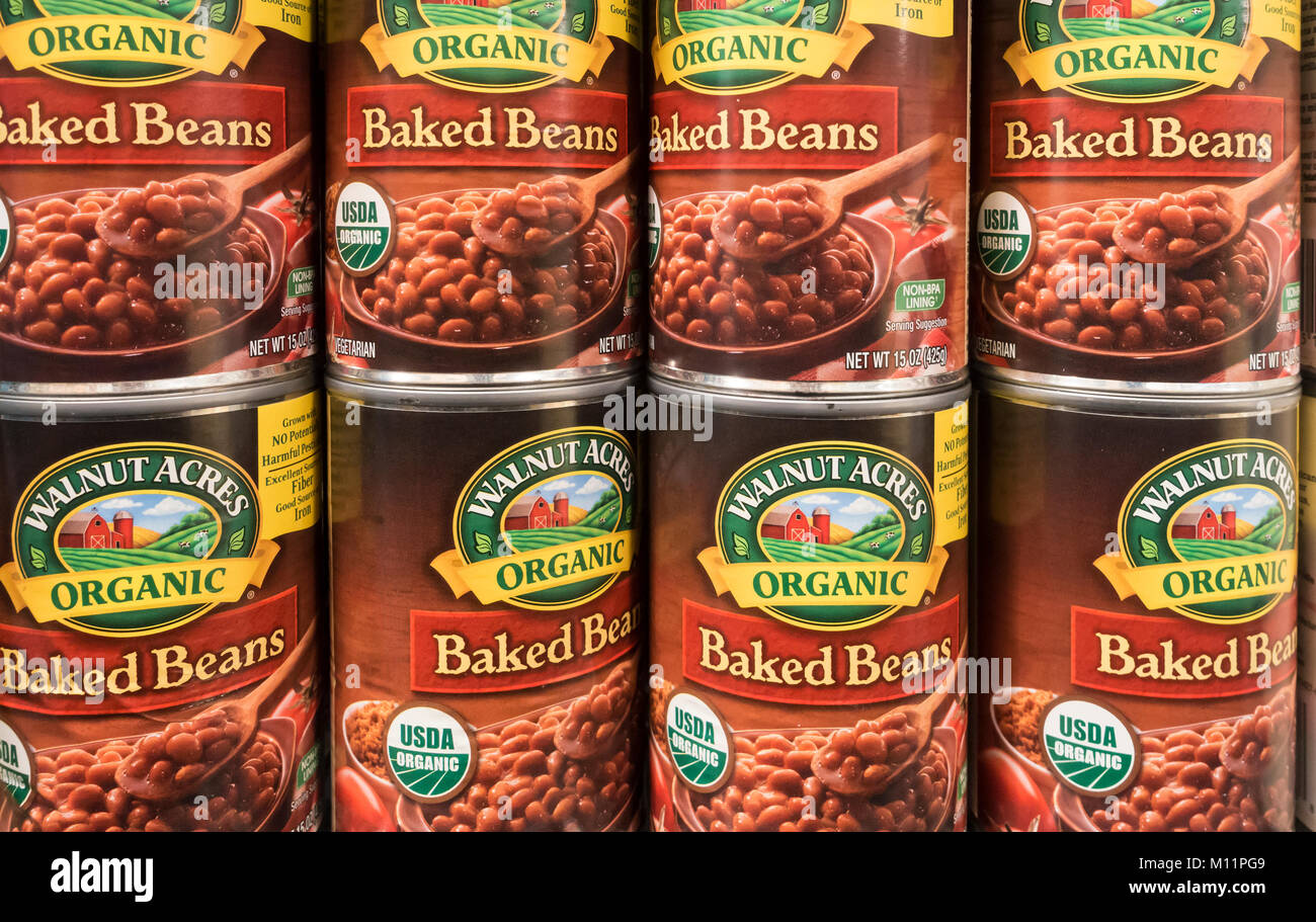 Cans of Walnut Acres organic baked beans on the shelves of a supermarket in the USA Stock Photo