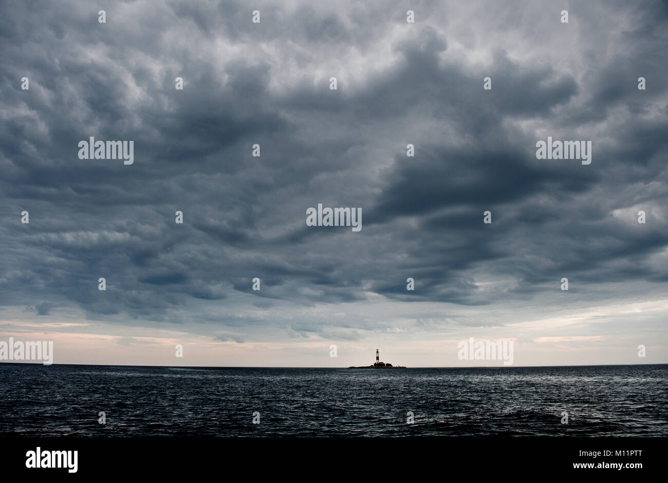 Lighthouse island in cloudy weather.Suho island. Ladoga.Twilights Stock Photo