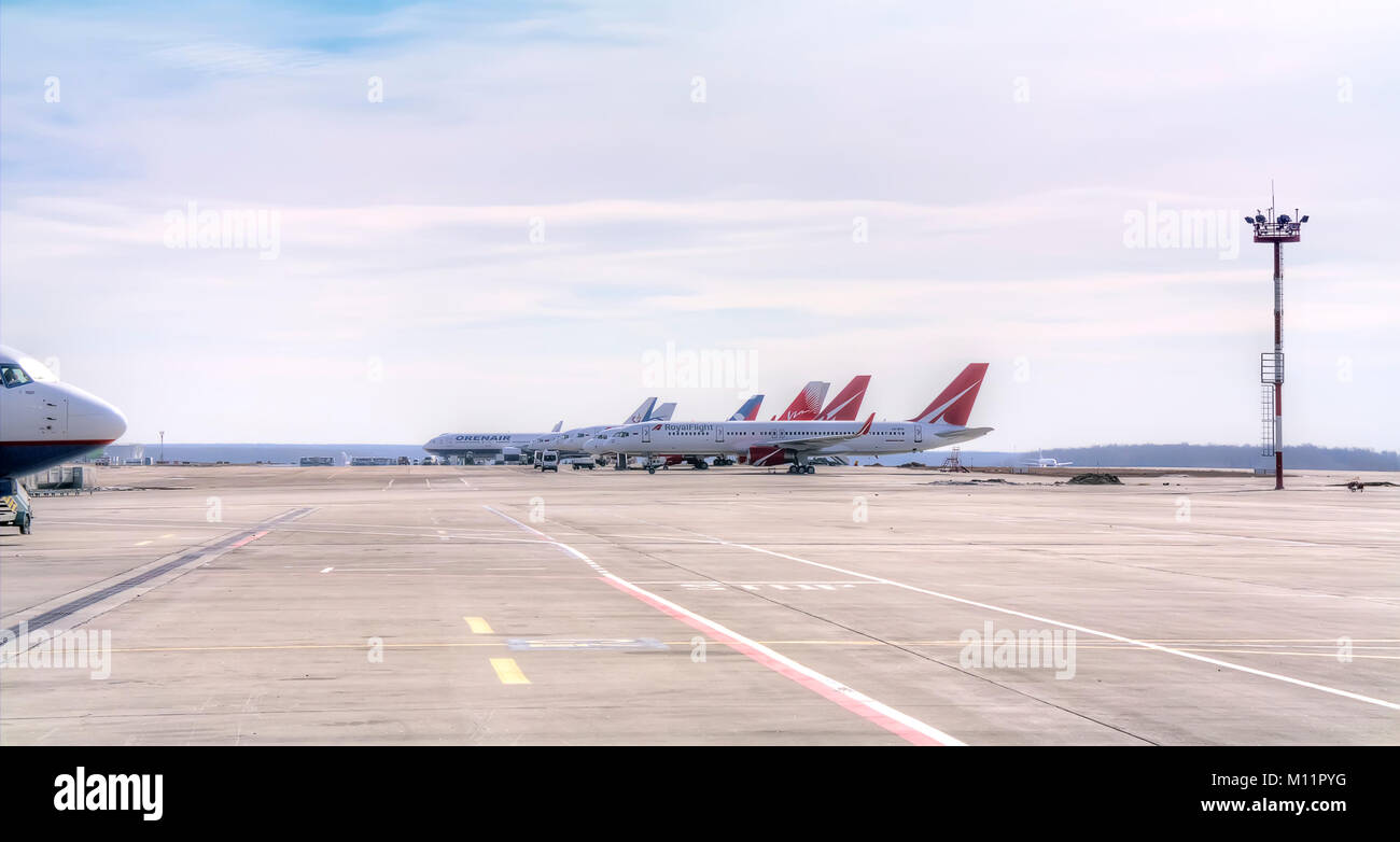 RUSSIA, EKATERINBURG - March 24.2015: Koltsovo Airport. Parking of aircraft on the flight field Stock Photo