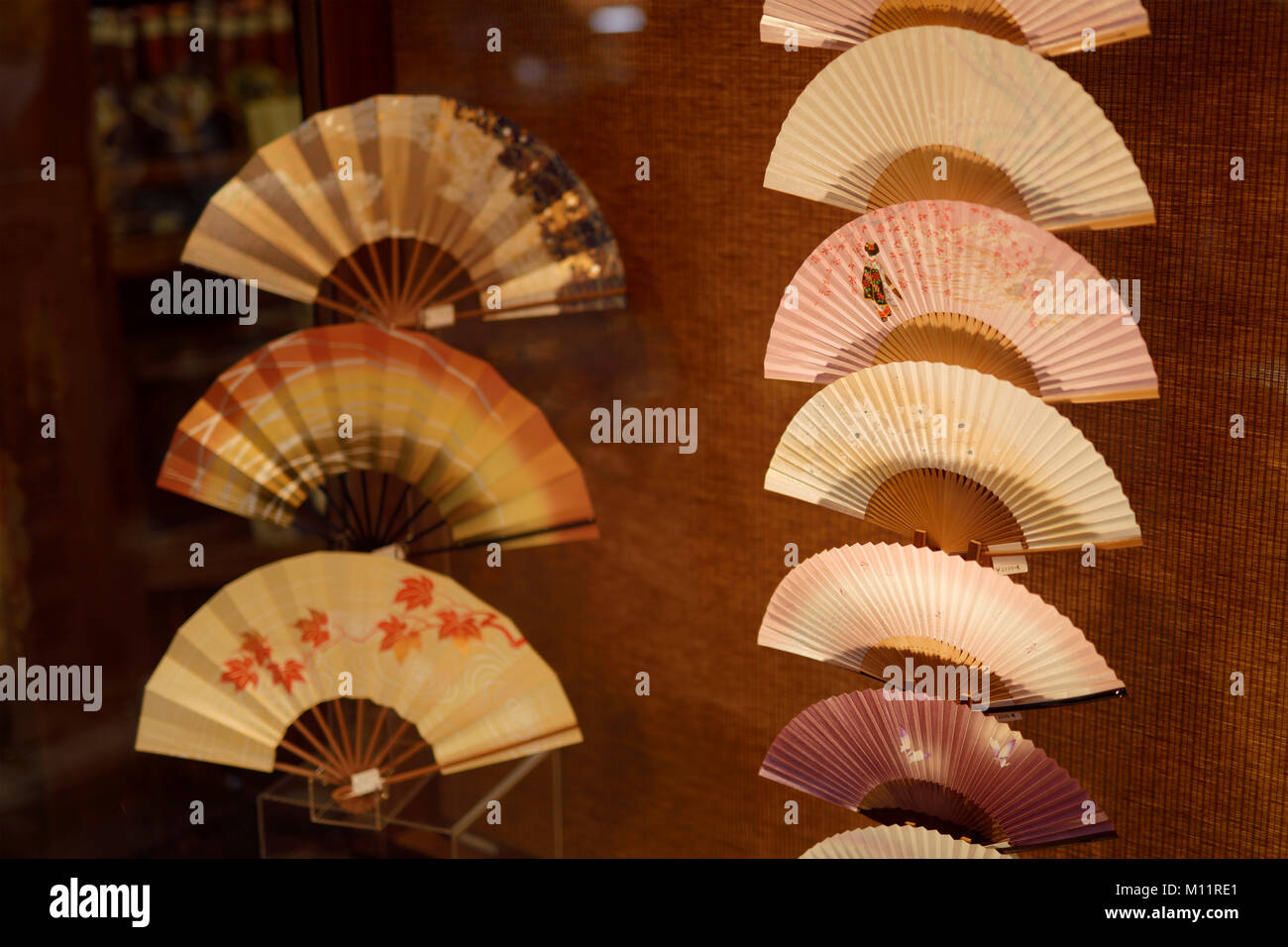 Traditional Japanese painted paper folding fans, Sensu, in store window display, Kyoto, Japan Stock Photo