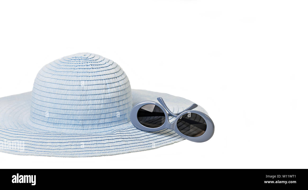 Summer woman's hat and sunglasses of blue color on isolated background ...