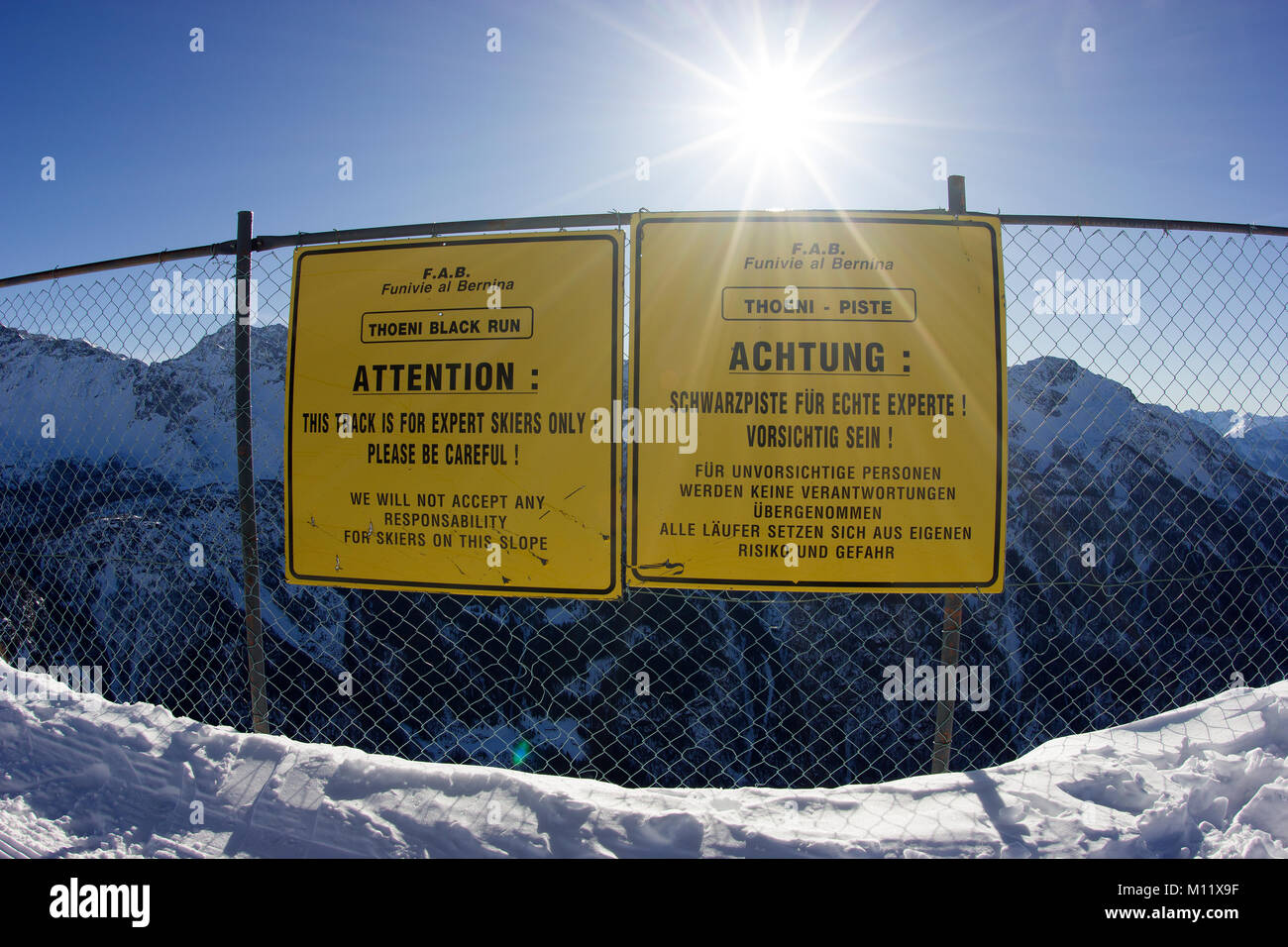 attention notice board/sign on ski piste 'only for expert skiers' black piste Stock Photo