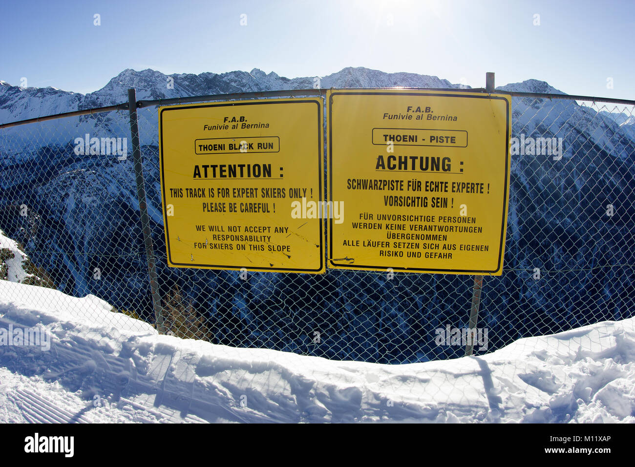 attention notice board/sign on ski piste 'only for expert skiers' black piste Stock Photo