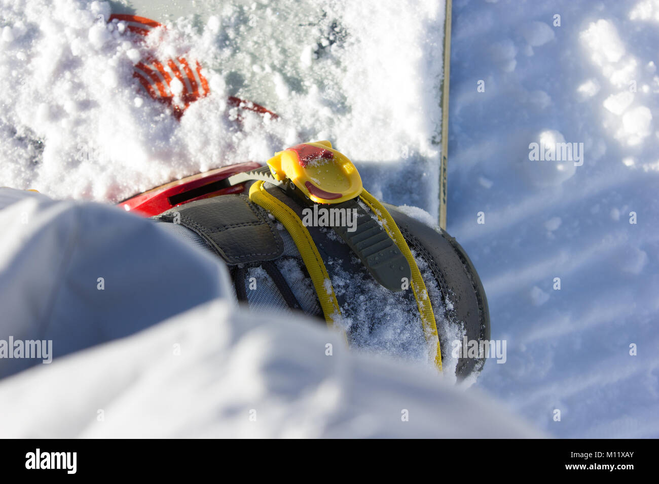 a beautiful detail photograph of snowboard bindings, snowboard boot and