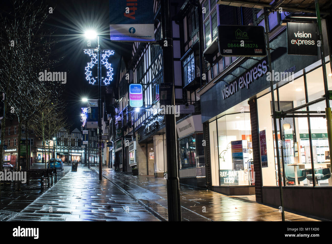 Wigan at Christmas. Very old fashioned scene here, looks great after being taken in the rain, reflects the light very well. Stock Photo