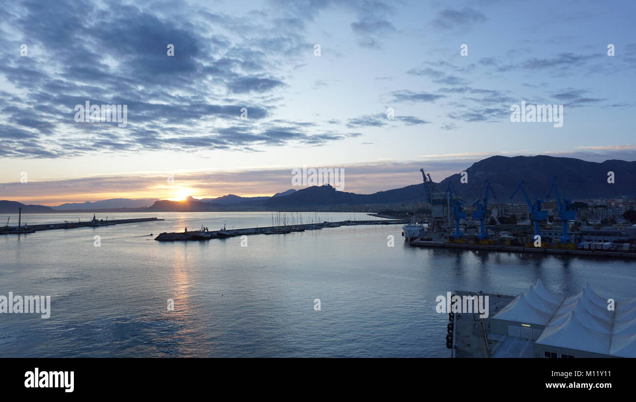 Cruising in the mediterranean sea near the Port of Palermo, Sicily, Italy by sunset and sunrise Stock Photo