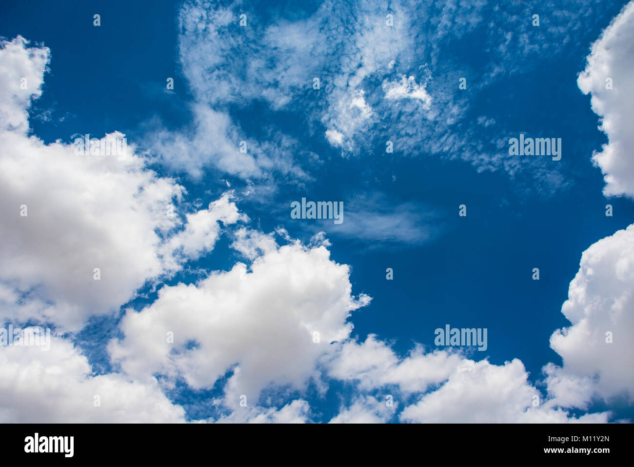 Blue sky with white and gray clouds Stock Photo - Alamy