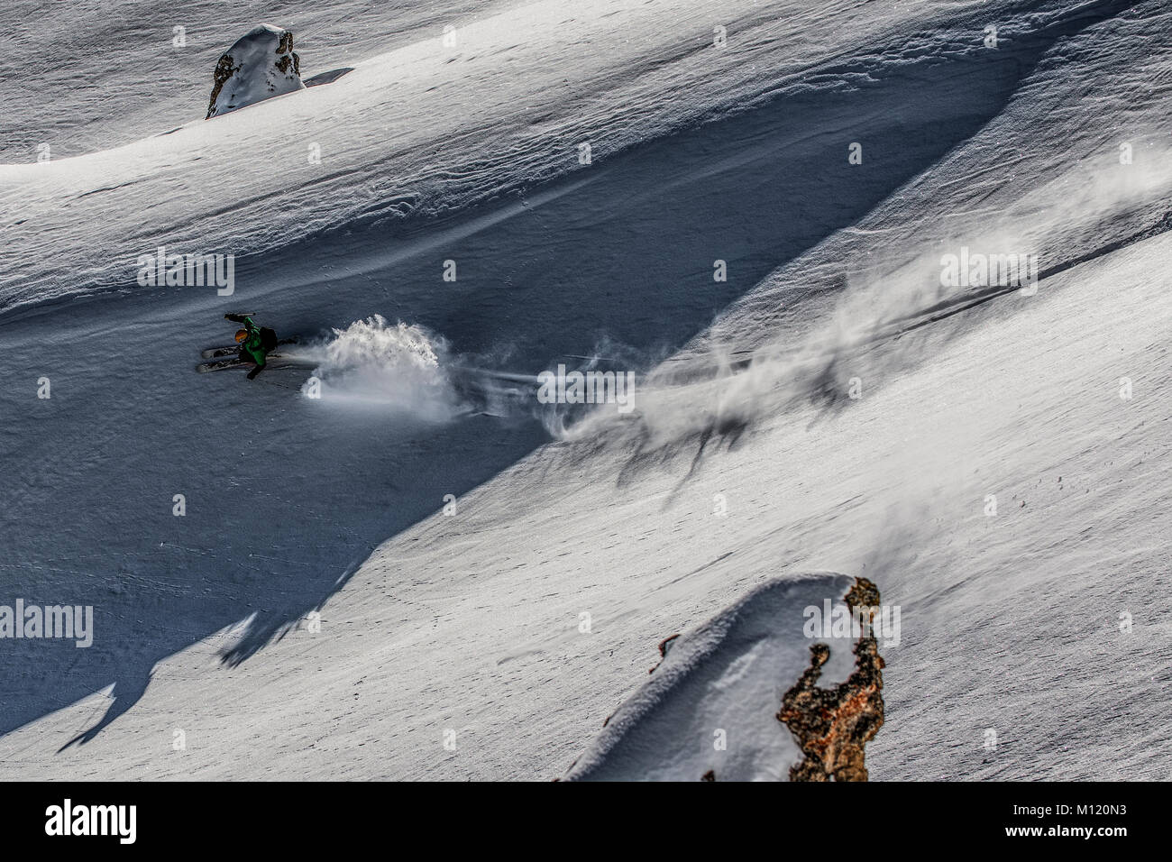 A skier skis off piste in the French alpine ski resort of Courchevel