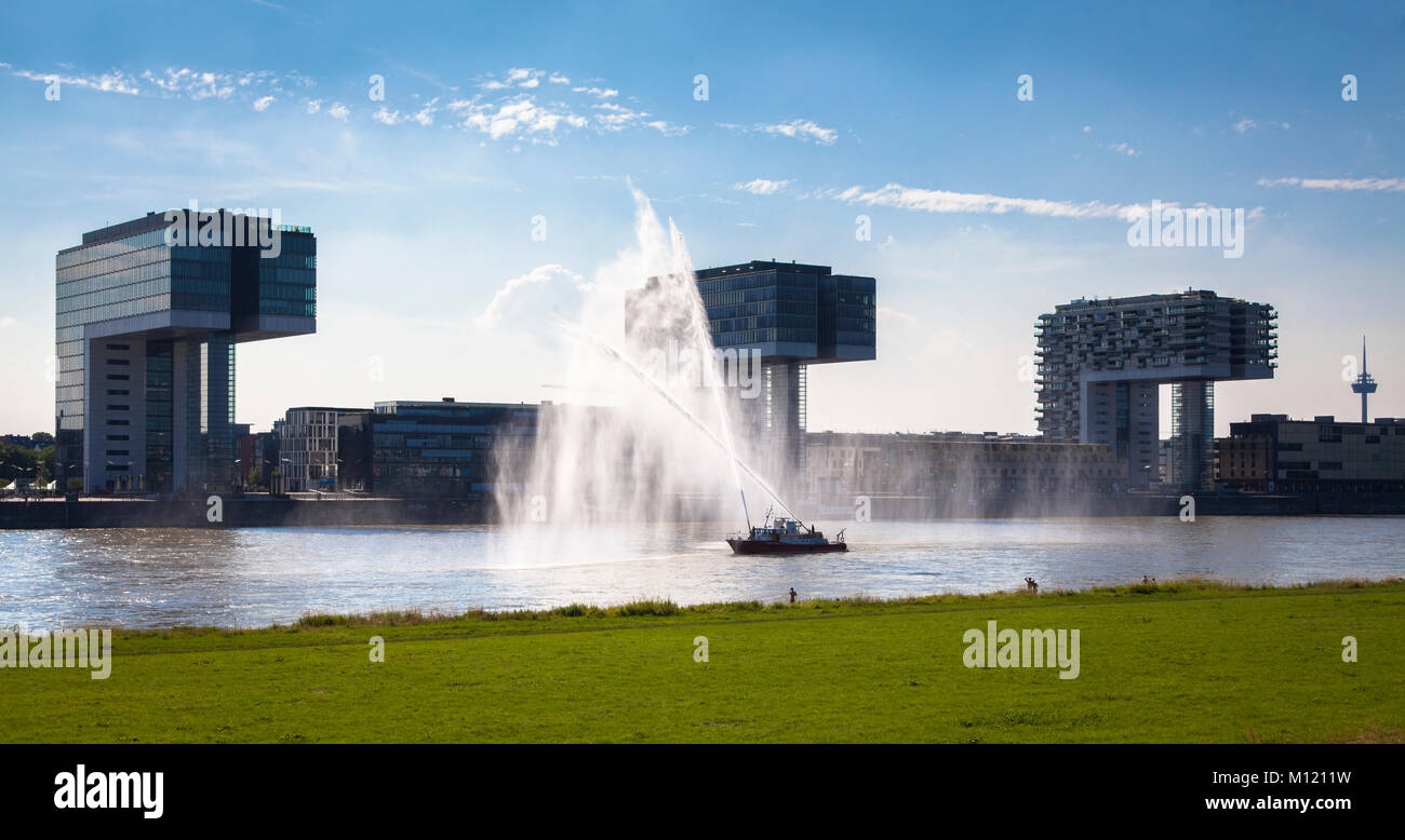 Germany, Cologne, firefighting boat duiring a fire drill on the river