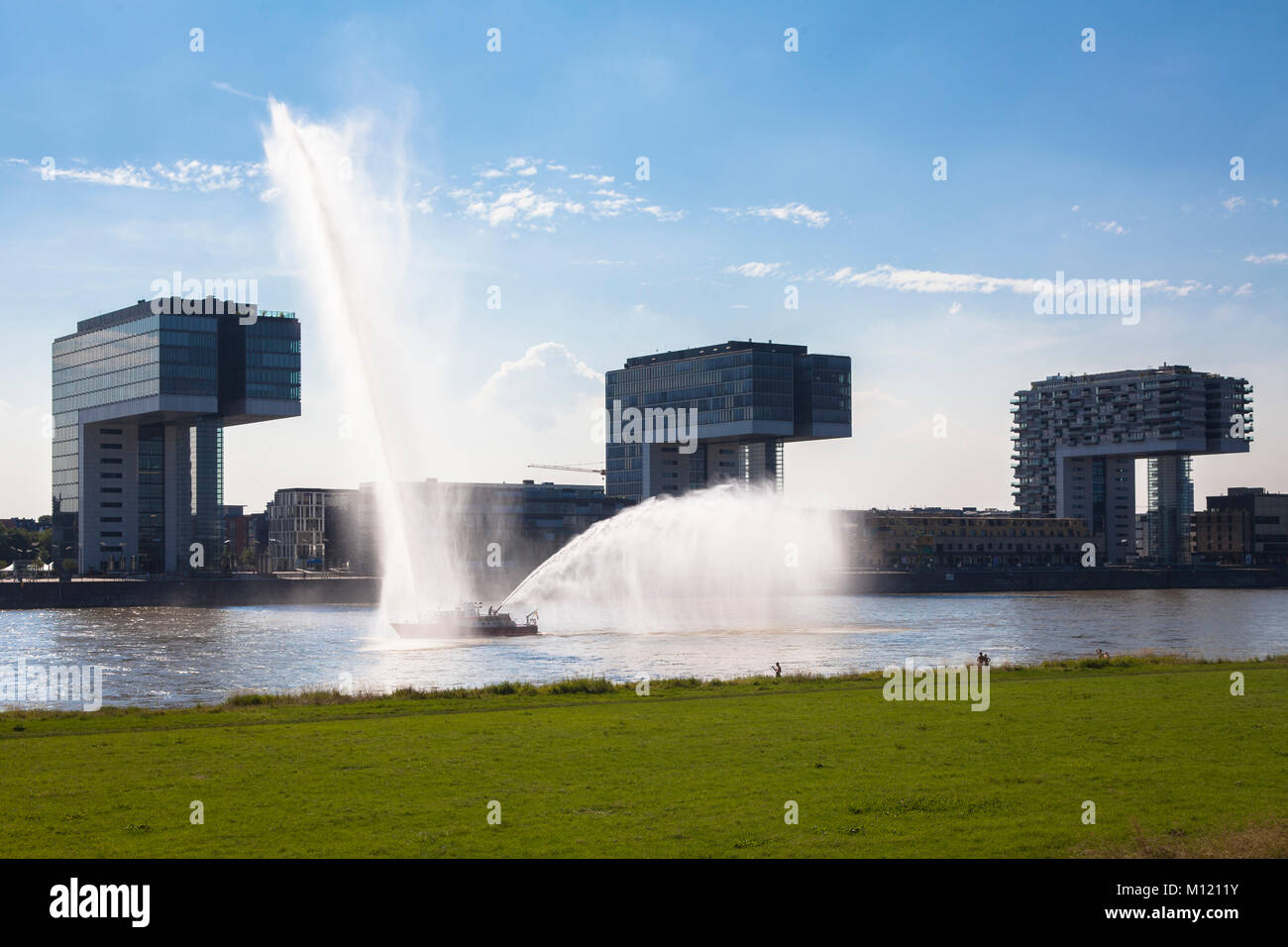 Germany, Cologne, firefighting boat duiring a fire drill on the river