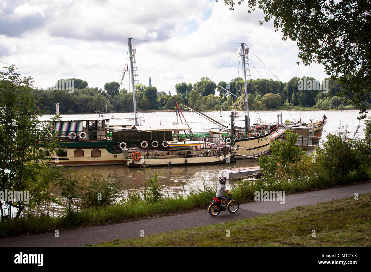 Germany, Cologne, old ships on the banks of the river Rhine in the district Weiss.  Deutschland, Koeln, alte Schiffe am Rheinufer im Stadtteil Weiss,  Stock Photo