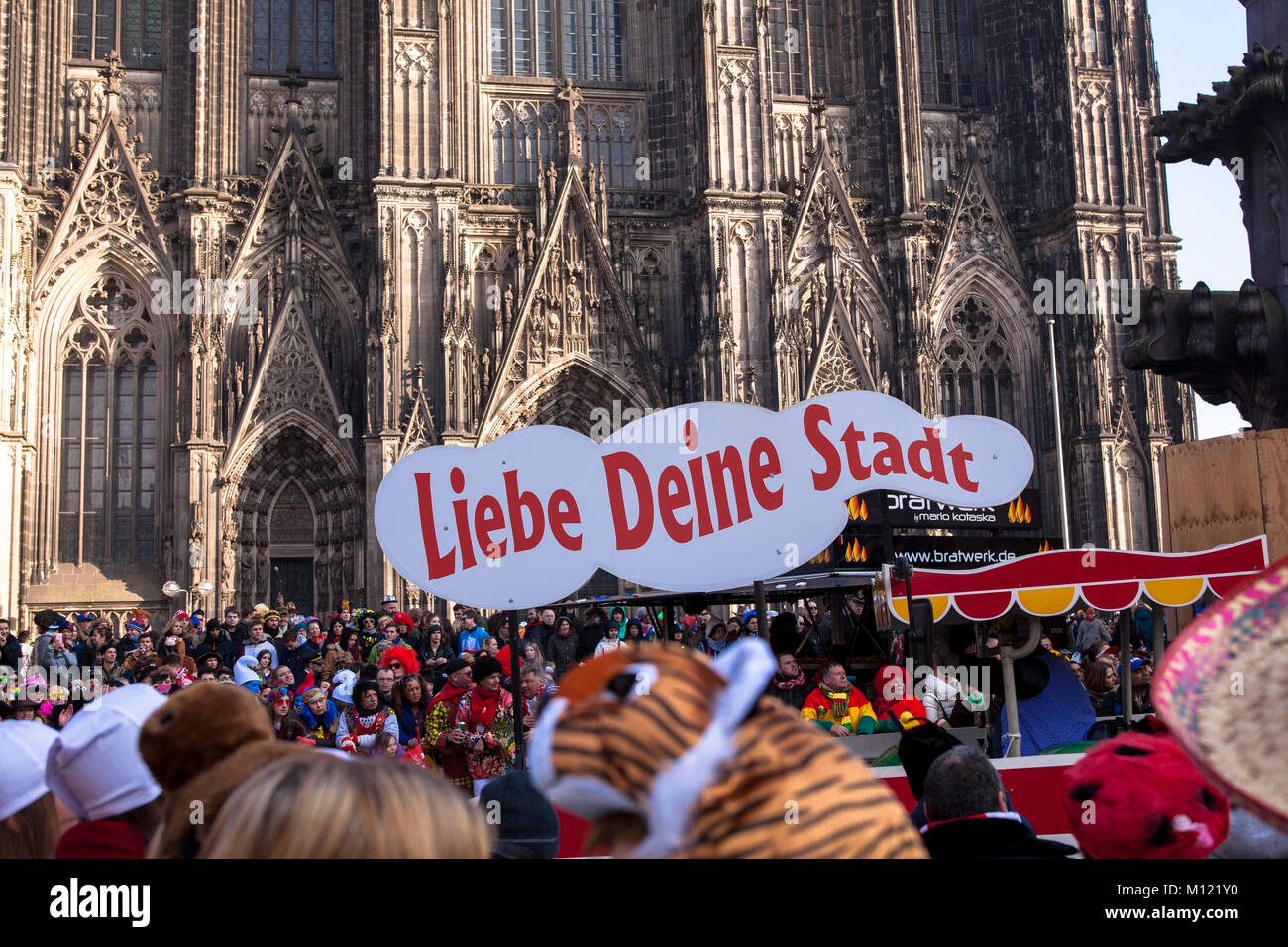 Germany, Cologne, carnival, Shrove Monday procession, float with the slogan Love your city in front of the cathedral.  Deutschland, Koeln, Karneval, R Stock Photo