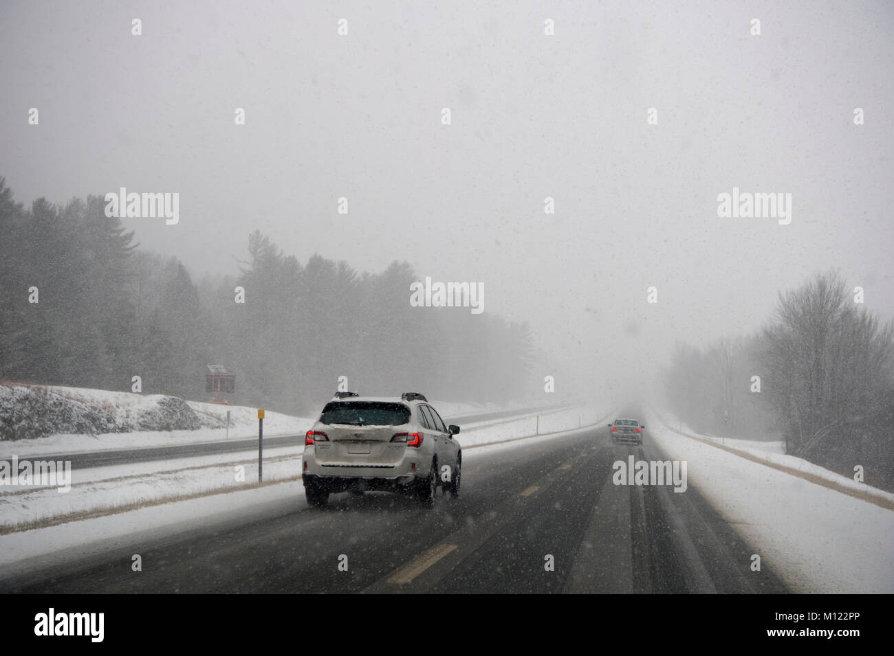 Driving on the high way through snow fall in Vermont Stock Photo Alamy