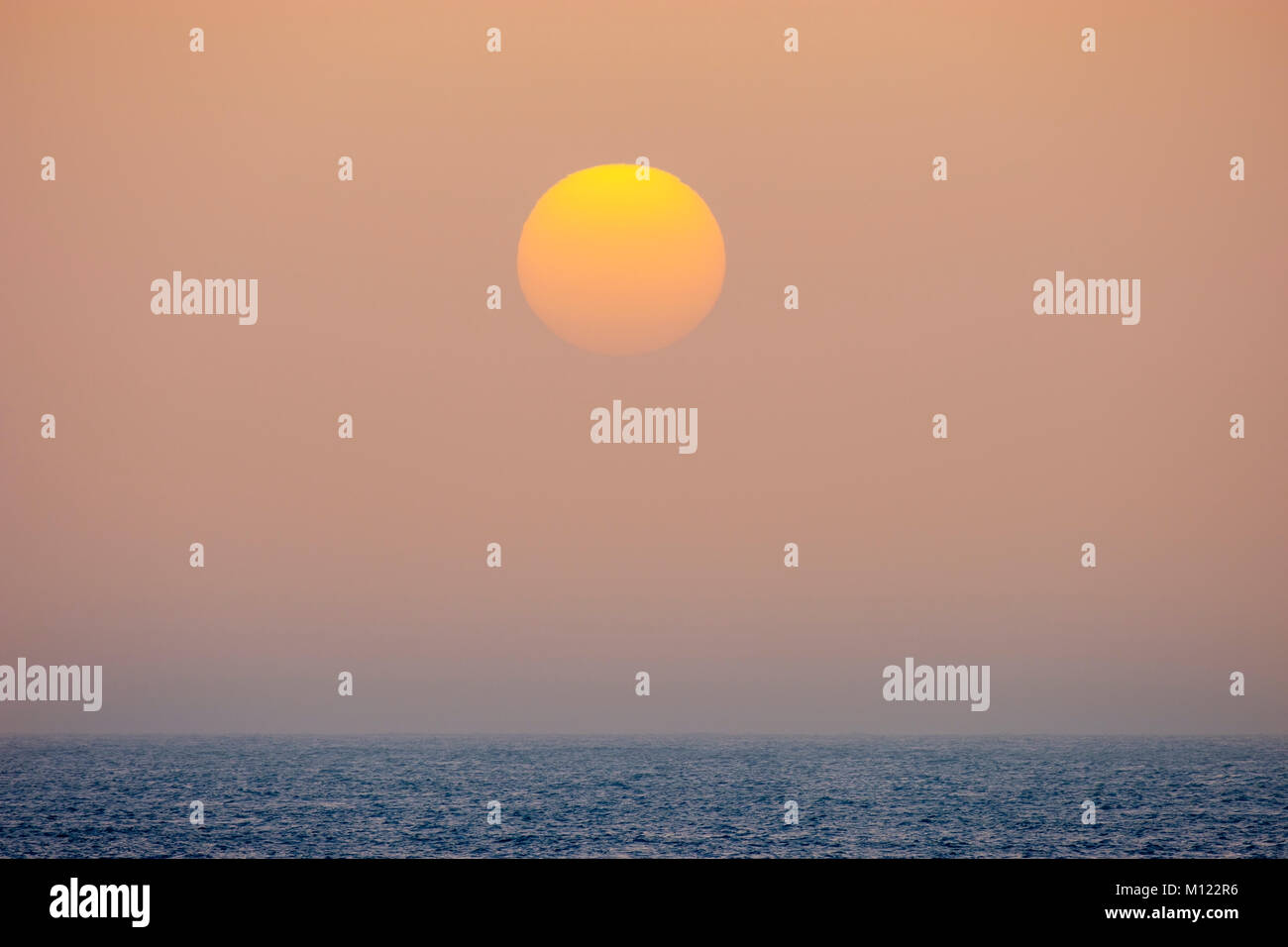 Sunset by sea fog,Atlantic,La Gomera,Canary Islands,Spain Stock Photo