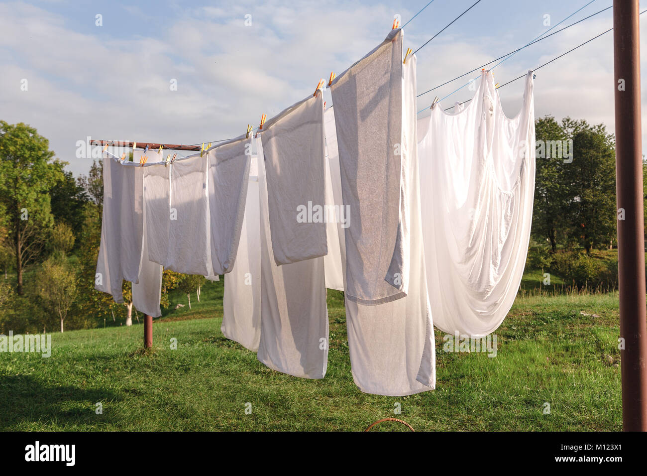 White shirt hanging on line outdoor hi-res stock photography and