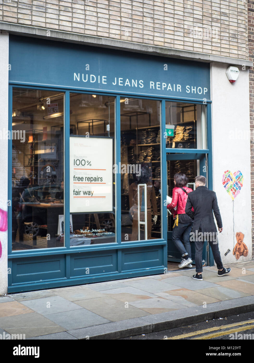 Nudie Jeans repair shop in Redchurch Street in London's Shoreditch district Stock Photo