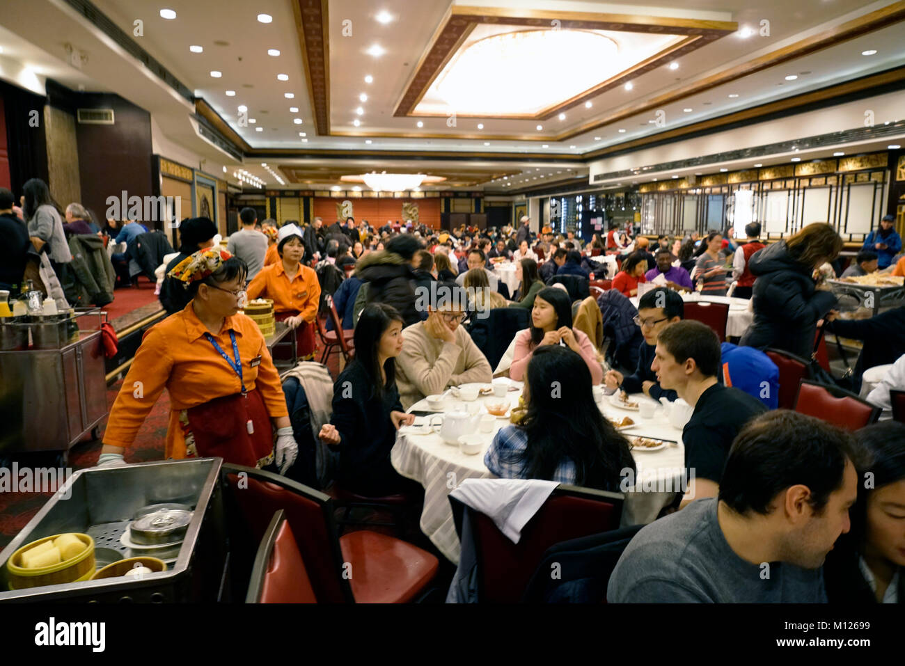 Dim sum carts rolled out in crowded Jing Fong Chinese restaurant in