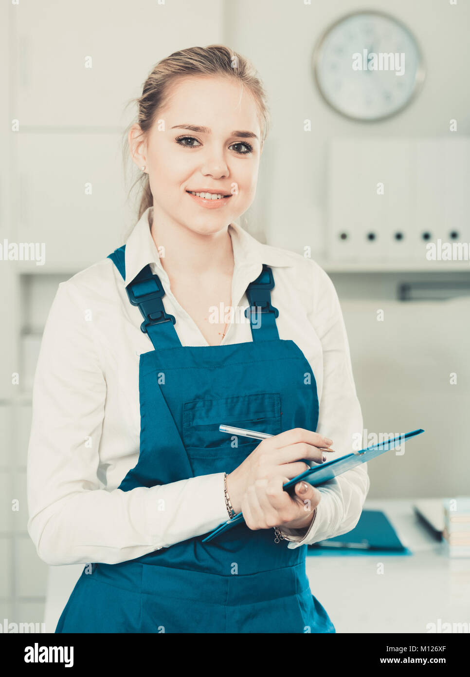 Attractive woman office cleaner writing tasks and instructions Stock ...
